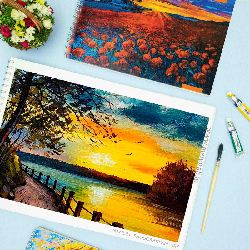 In a 140 GSM Menorah sketchbook, an artist has captured the serene beauty of a sunset over a tranquil lake in a stunning A3-sized drawing. The vibrant hues of the setting sun reflect gracefully on the water's surface, creating a mesmerizing scene that evokes a sense of peace and awe