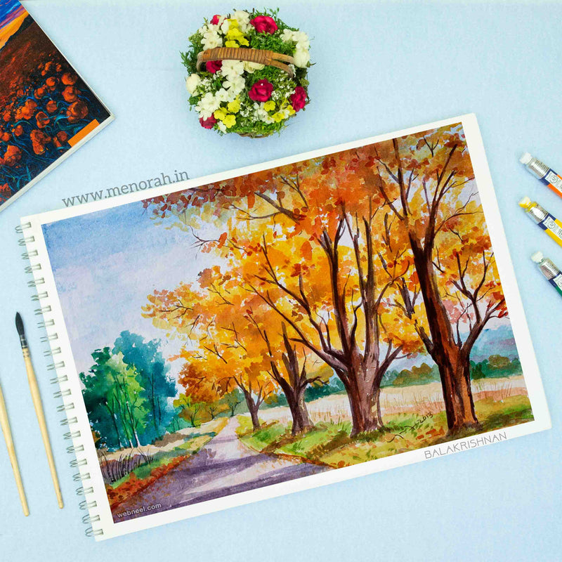 In a Menorah A3 sketchbook, a captivating watercolor painting depicts the tranquil beauty of a roadside nature scene, alive with lush greenery and delicate flora. The artist's skillful brushwork captures the essence of the serene landscape, inviting viewers to immerse themselves in the peaceful ambiance of the countryside. 