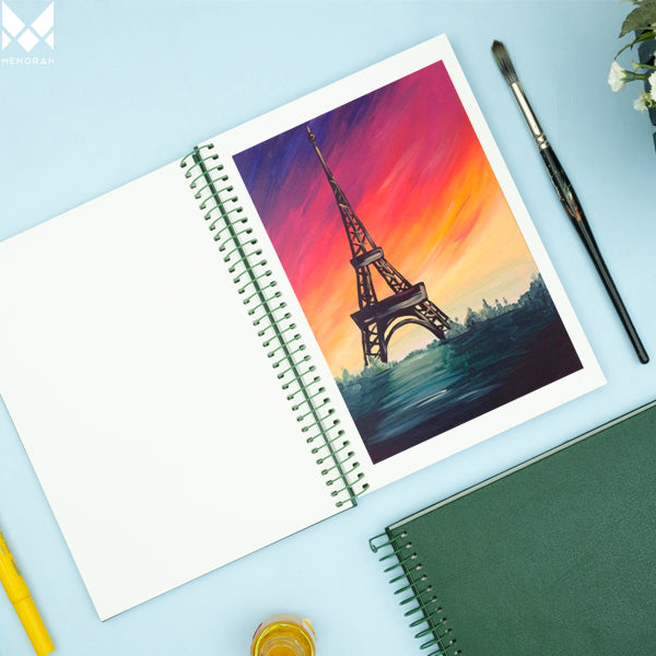 Eiffel tower watercolor painting on  A5 size watercolor sketchbook is the best travel accompanion for the creators. Watercolor sketchbook is made of 100% cotton and is 100% Vegan. It contains 40 pages with a 300GSM Thickness so that watercolor won't penetrate to the other page. It is covered by Metal spiral with 360 Degree easy turn. Make your creations by using watercolour paintings, Acrylics, Gouache, Tempera, Poster colour in this sketchbook. Bright Blue color sketchbook