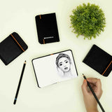 Charcoal pencil portrait drawing in mini A7 sketchbook, small size sketchbook. #color_black