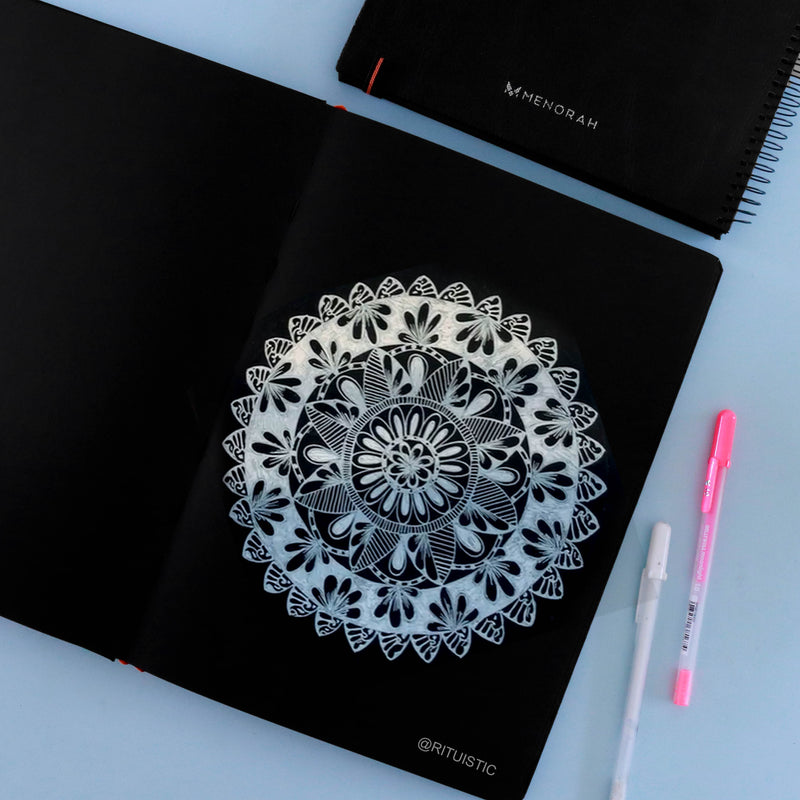 Mandala Painting with white marker painting on 250 GSM Black sketchbook.