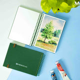 Beautiful Nature scenery Tree painting on A6 size watercolor sketchbook is the best travel accompanion for the creators. Watercolor sketchbook is made of 100% cotton and is 100% Vegan. It contains 40 pages with a 300GSM Thickness so that watercolor won't penetrate to the other page. It is covered by Metal spiral with 360 Degree easy turn. Make your creations by using watercolour paintings, Acrylics, Gouache, Tempera, Poster colour in this sketchbook. Bright Blue color sketchbook